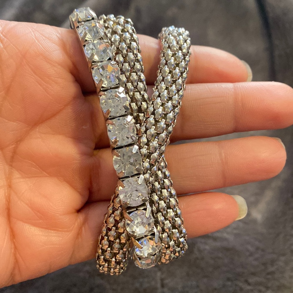 Set of three attached silvertone bracelets 2
chainsaws one with crystals 80’s